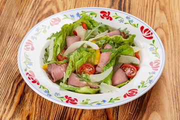 gourmet salad on the wooden background