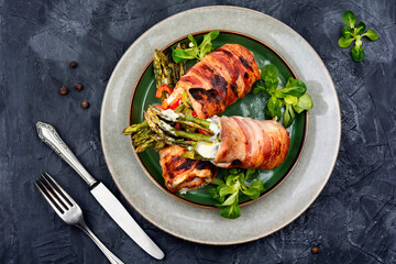 Yummy bacon meat roll stuffed with asparagus.