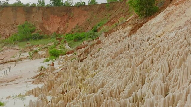 Fly over Tsingy rouge in Madagascar - long drone shot