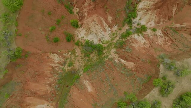 Spinning over red volcano canyon - abstract, topshot, drone footage