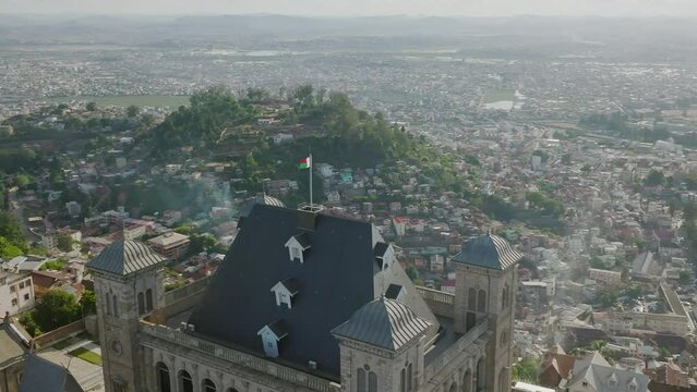 Fly over the Malagasy flag on Rova - kings palace on the hill in Antananarivo - capital of Madagscar
