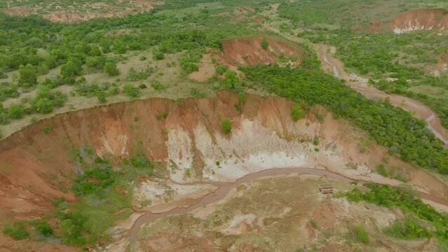 Aerial drone shot of red volcano soil and Tsingy rouge area in Madagascar - long clip
