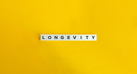 Longevity Word. Letter Tiles on Yellow Background. Minimal Aesthetic.
