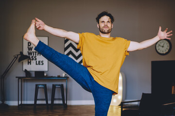 Hipster guy engaged in meditation and practicing healthy lifestyle