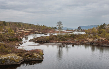 Fototapeta na wymiar Skrelifallan Waterfall surroundings, Skrelia, Lyngdal, Norway.