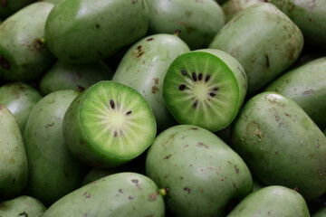 organic baby kiwi, cross-section, close up