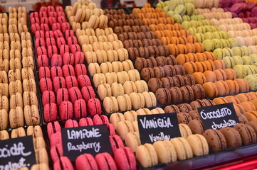assortment of flavoured pastries called macarons arranged in rows