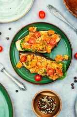 Stuffed aubergine with fried vegetables