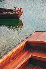 Fototapeta na wymiar Wooden dinghy boats on Lake Bohinj in Slovenia