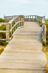 Wooden path to beach sea water.