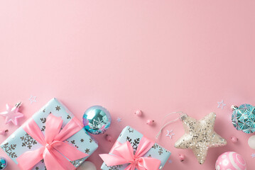 Chic festive winter soirée adorned with stylish ornaments motif. Top view image of balls, sparkling star, feminine gift parcels, mistletoe berries on pastel pink surface with space for text or promo