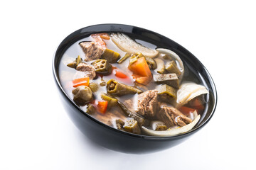 Traditional African okra soup isolated on white background