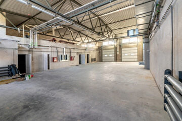 Industrial building or modern factory for manufacturing production plant or large warehouse
