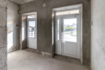 Renovation of the building - exit with large plastic doors