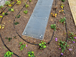 metal grates and a hatch on the roof garden. sheet metal and metal covering the entrances to the...