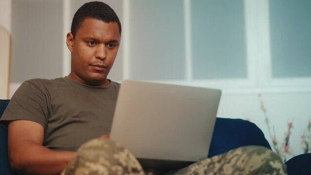 Busy soldier in uniform working on laptop, veteran searching online therapy