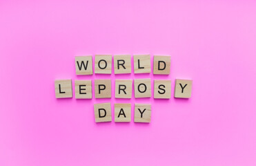 January 30, World leprosy day, minimalistic banner with the inscription in wooden letters