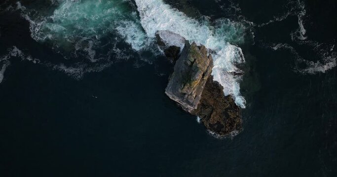Flying over the Branaunmore sea stack of the Cliffs of Moher 