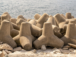 Fototapeta na wymiar close up of a bank of coastal sea defence concrete blocks interlinked on the beach