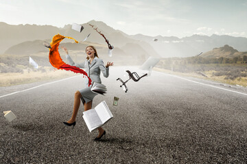 Young pretty businesswoman juggling with business items - obrazy, fototapety, plakaty