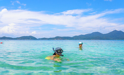 young boy snorkeling in the sea
