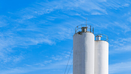 Banner industry cement factory, sunlight. Concrete mortar mixing tower silo © Parilov