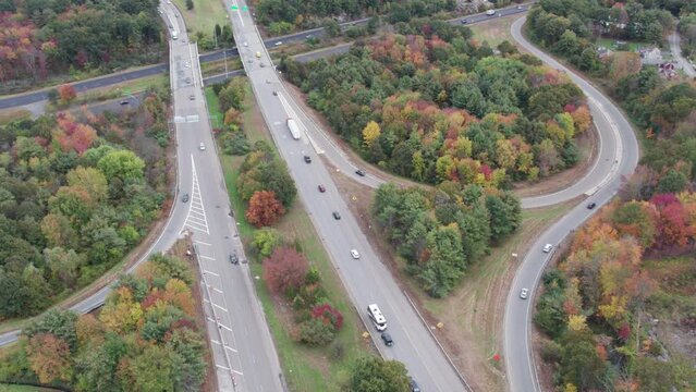 Drone footage over Donald Lynch Boulevard and Route 495 in Marlboro, Massachusetts. On off ramps and overpass visible.