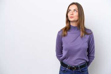 Young caucasian woman isolated on white background and looking up