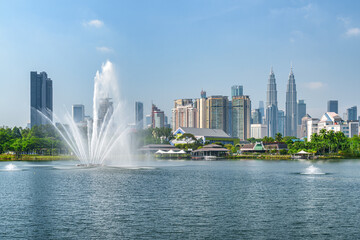 Awesome Kuala Lumpur skyline. Scenic lake and fountains
