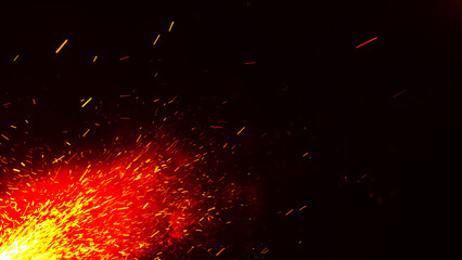 Fototapeta na wymiar Fiery sparks on a dark background. Glowing sparks fly upward. Realistic fire, sparks and flames. Yellow and red light effect. Fiery orange glowing flying particles on a black background in 4k