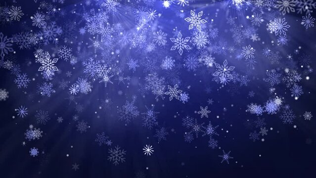 Falling white snowflakes with bright particles and glow on winter blue background. Looped holiday animation.