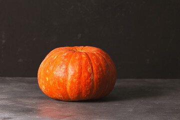 Autumn pumpkin on a black background