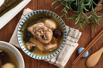 Delicious Taiwanese peeled green chili pepper chicken soup with mushroom