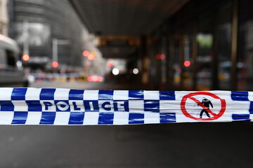 View of generic police tape at a crime scene