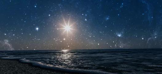 Poster a star shines in the night sky over the sea on the holiday of Christmas © vovan