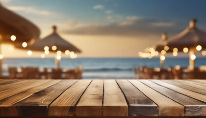 Naklejka na ściany i meble wooden table and blur beach cafes background with bokeh lights high quality photo