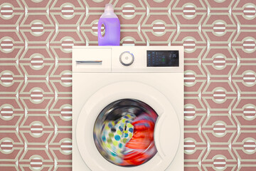 Modern electronic washing machine with rotating colorful laundry in front of retro wallpaper