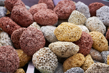 Texture of colored pumice stones for foot care. Colorful pumices in different sizes.