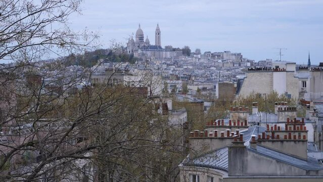 Paris France - Avril 7, 2021: A view of the North of Paris and Montmartre from the Bergeyre hill.