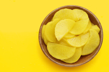 Sweet and tart slices of yellow pickled daikon, known as takuan in Japan and danmuji in Korea.