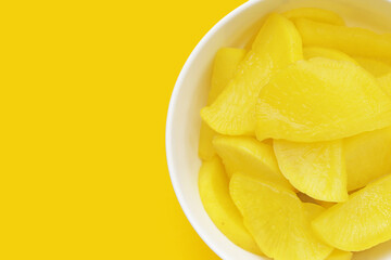 Sweet and tart slices of yellow pickled daikon, known as takuan in Japan and danmuji in Korea.