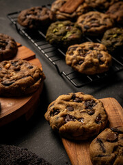 Cookies are arranged messily on a wooden placemat, isolated with a wooden table background.