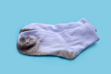 Dirty white socks on blue background.