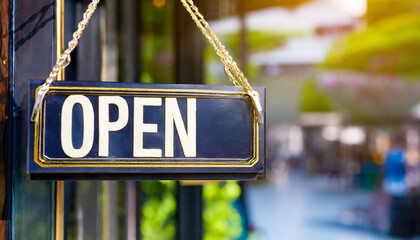 open sign hanging outside a restaurant store office or other