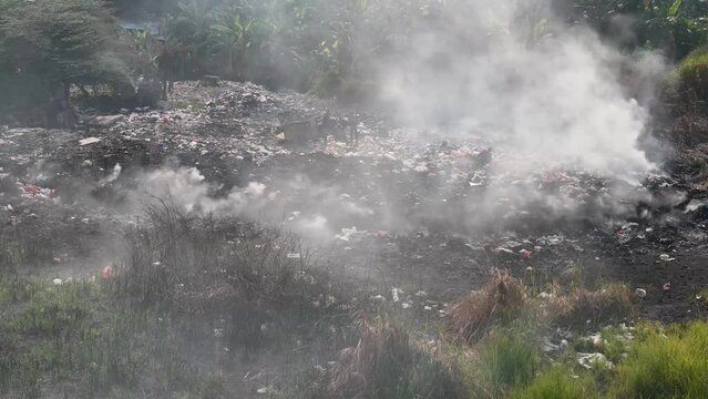 aerial view of trash burning. land with rubbish, Landfill landscape ecological damage contaminated land. plastic waste in landfills, environmental pollution problems, waste or rubbish from households