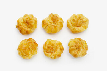 Cream puffs on white background