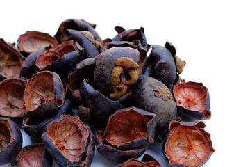 Dried mangosteen peels on white background.