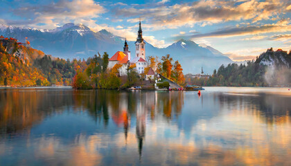 attractive morning view of pilgrimage church of assumption of maria impressive autumn scene of bled lake julian alps slovenia europe traveling concept background - obrazy, fototapety, plakaty