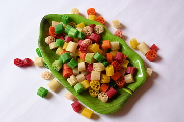 Raw fryums snack. Its other names Far far.  It's deep fried, and they are either eaten as a snack or served like a papadum to accompany a meal. Indian snack composed primarily of potato starch, sago.