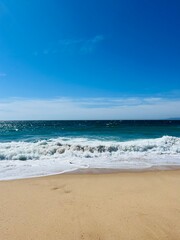 Fototapeta na wymiar sandy ocean coast, waves ocean, blue horizon, natural ocean shore background